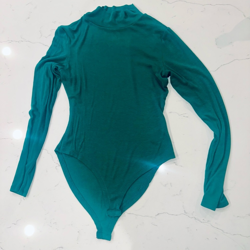 Teal Bodysuit
Ribbed, mock neck.